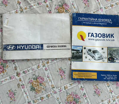 Сірий Хендай Туксон, об'ємом двигуна 1.98 л та пробігом 250 тис. км за 5400 $, фото 16 на Automoto.ua