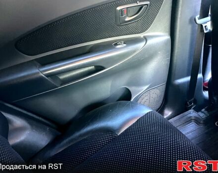 Серый Хендай Туксон, объемом двигателя 2 л и пробегом 130 тыс. км за 8700 $, фото 3 на Automoto.ua