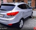 Серый Хендай Туксон, объемом двигателя 2.4 л и пробегом 115 тыс. км за 11500 $, фото 2 на Automoto.ua