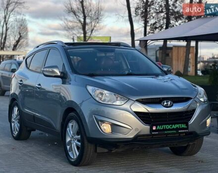 Серый Хендай Туксон, объемом двигателя 2.36 л и пробегом 150 тыс. км за 12990 $, фото 3 на Automoto.ua