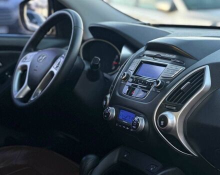 Серый Хендай Туксон, объемом двигателя 2.4 л и пробегом 150 тыс. км за 12990 $, фото 15 на Automoto.ua