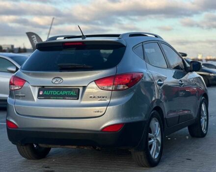 Серый Хендай Туксон, объемом двигателя 2.4 л и пробегом 150 тыс. км за 12990 $, фото 6 на Automoto.ua