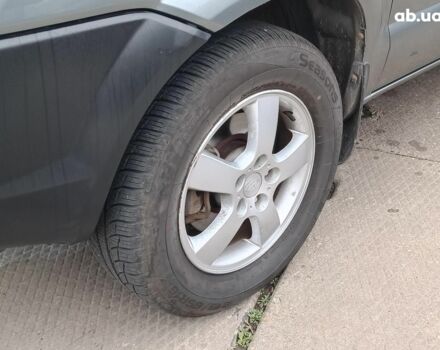 Сірий Хендай Туксон, об'ємом двигуна 2 л та пробігом 148 тис. км за 10390 $, фото 3 на Automoto.ua