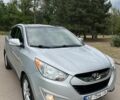Серый Хендай Туксон, объемом двигателя 2.4 л и пробегом 164 тыс. км за 12500 $, фото 1 на Automoto.ua