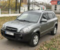 Серый Хендай Туксон, объемом двигателя 1.98 л и пробегом 77 тыс. км за 10500 $, фото 7 на Automoto.ua
