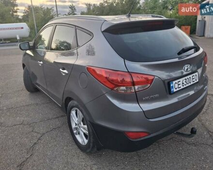 Сірий Хендай Туксон, об'ємом двигуна 2 л та пробігом 212 тис. км за 13600 $, фото 15 на Automoto.ua