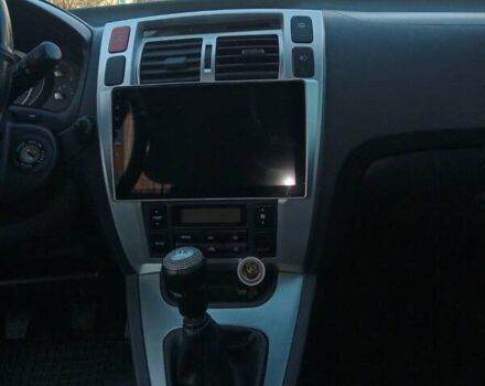 Серый Хендай Туксон, объемом двигателя 2 л и пробегом 82 тыс. км за 11500 $, фото 4 на Automoto.ua