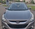 Сірий Хендай Туксон, об'ємом двигуна 2 л та пробігом 212 тис. км за 13600 $, фото 12 на Automoto.ua