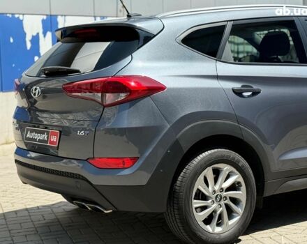 Серый Хендай Туксон, объемом двигателя 1.6 л и пробегом 150 тыс. км за 14490 $, фото 4 на Automoto.ua