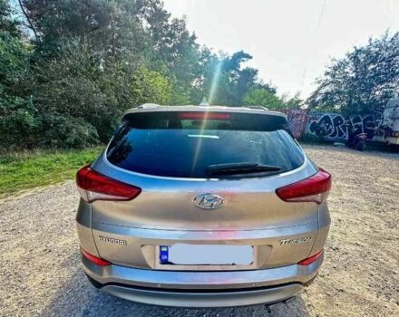 Серый Хендай Туксон, объемом двигателя 2.4 л и пробегом 94 тыс. км за 10700 $, фото 6 на Automoto.ua