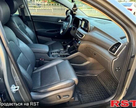 Серый Хендай Туксон, объемом двигателя 2 л и пробегом 129 тыс. км за 23999 $, фото 7 на Automoto.ua