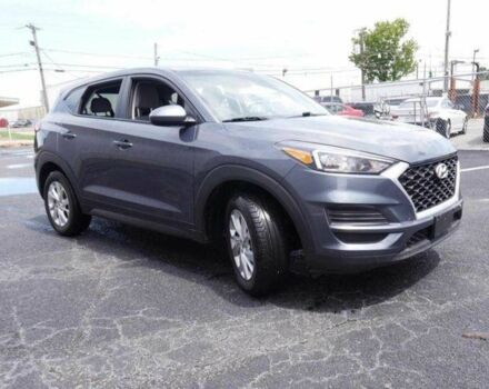 Серый Хендай Туксон, объемом двигателя 2 л и пробегом 149 тыс. км за 15000 $, фото 2 на Automoto.ua