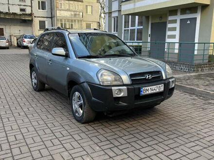 Серый Хендай Туксон, объемом двигателя 1.98 л и пробегом 269 тыс. км за 7500 $, фото 1 на Automoto.ua