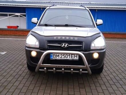 Серый Хендай Туксон, объемом двигателя 1.98 л и пробегом 157 тыс. км за 7800 $, фото 1 на Automoto.ua