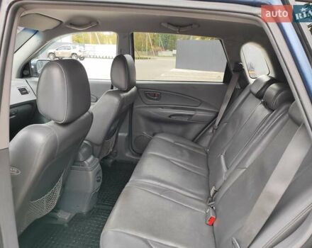 Синий Хендай Туксон, объемом двигателя 1.99 л и пробегом 225 тыс. км за 8000 $, фото 12 на Automoto.ua