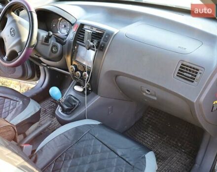 Синий Хендай Туксон, объемом двигателя 1.98 л и пробегом 280 тыс. км за 4800 $, фото 15 на Automoto.ua