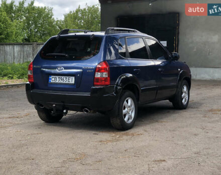 Синий Хендай Туксон, объемом двигателя 1.99 л и пробегом 315 тыс. км за 6700 $, фото 4 на Automoto.ua