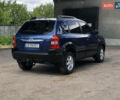 Синий Хендай Туксон, объемом двигателя 1.99 л и пробегом 315 тыс. км за 6700 $, фото 4 на Automoto.ua