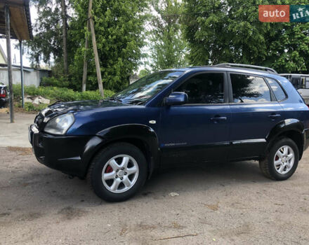 Синий Хендай Туксон, объемом двигателя 1.99 л и пробегом 315 тыс. км за 6700 $, фото 3 на Automoto.ua