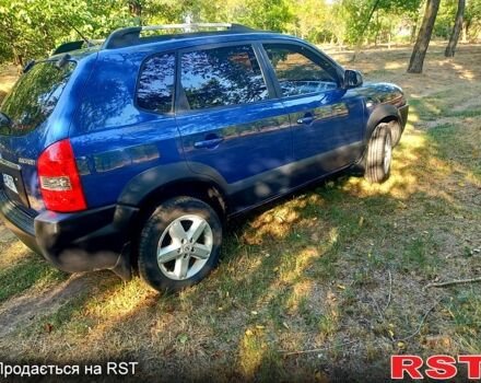 Синій Хендай Туксон, об'ємом двигуна 2 л та пробігом 227 тис. км за 7000 $, фото 4 на Automoto.ua