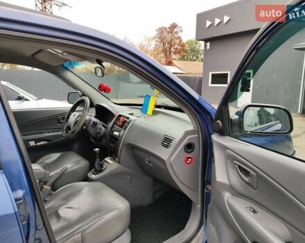 Синий Хендай Туксон, объемом двигателя 1.99 л и пробегом 225 тыс. км за 8000 $, фото 16 на Automoto.ua