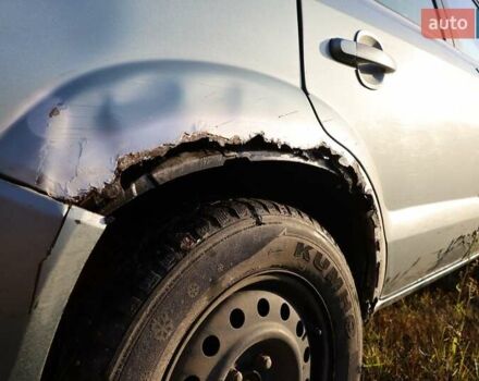 Синий Хендай Туксон, объемом двигателя 1.98 л и пробегом 280 тыс. км за 4800 $, фото 7 на Automoto.ua