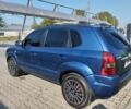 Синий Хендай Туксон, объемом двигателя 2 л и пробегом 310 тыс. км за 6500 $, фото 3 на Automoto.ua