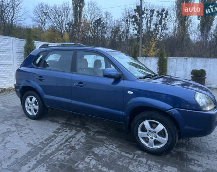 Синий Хендай Туксон, объемом двигателя 1.98 л и пробегом 218 тыс. км за 7300 $, фото 3 на Automoto.ua