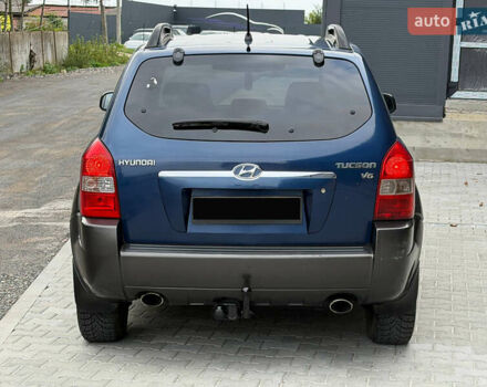 Синий Хендай Туксон, объемом двигателя 2.66 л и пробегом 320 тыс. км за 6300 $, фото 5 на Automoto.ua