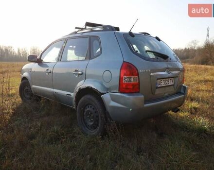 Синий Хендай Туксон, объемом двигателя 1.98 л и пробегом 280 тыс. км за 4800 $, фото 3 на Automoto.ua