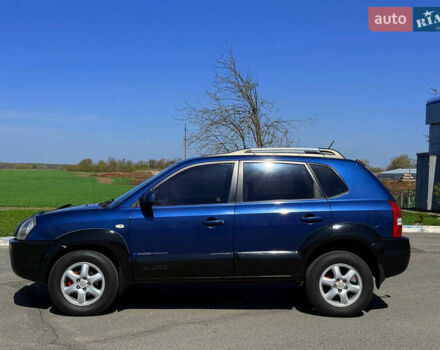 Синий Хендай Туксон, объемом двигателя 2 л и пробегом 320 тыс. км за 6300 $, фото 3 на Automoto.ua