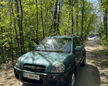 Синий Хендай Туксон, объемом двигателя 1.99 л и пробегом 272 тыс. км за 6800 $, фото 4 на Automoto.ua