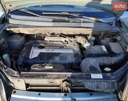 Синий Хендай Туксон, объемом двигателя 1.98 л и пробегом 280 тыс. км за 4800 $, фото 13 на Automoto.ua