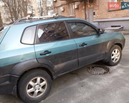 Синий Хендай Туксон, объемом двигателя 1.98 л и пробегом 273 тыс. км за 4900 $, фото 4 на Automoto.ua
