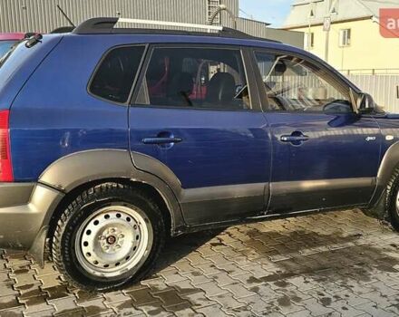 Синий Хендай Туксон, объемом двигателя 1.99 л и пробегом 313 тыс. км за 6000 $, фото 24 на Automoto.ua