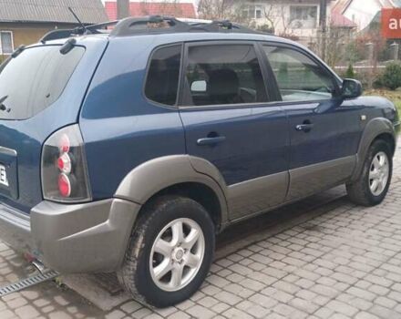 Синий Хендай Туксон, объемом двигателя 2.66 л и пробегом 320 тыс. км за 5500 $, фото 2 на Automoto.ua