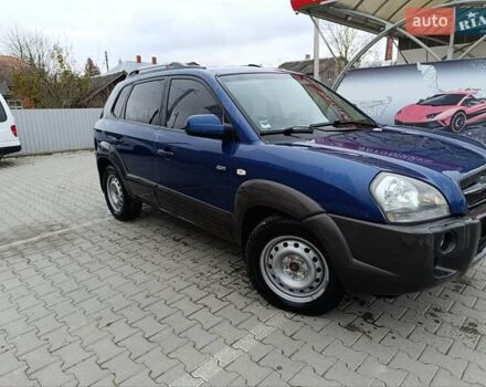 Синий Хендай Туксон, объемом двигателя 2 л и пробегом 314 тыс. км за 6700 $, фото 2 на Automoto.ua