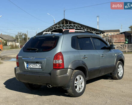 Синій Хендай Туксон, об'ємом двигуна 2 л та пробігом 317 тис. км за 6990 $, фото 5 на Automoto.ua