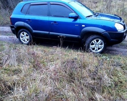 Синий Хендай Туксон, объемом двигателя 2 л и пробегом 219 тыс. км за 8400 $, фото 4 на Automoto.ua