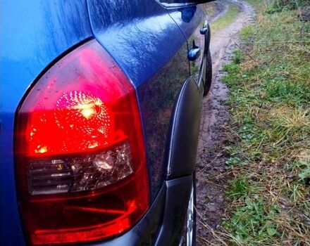 Синий Хендай Туксон, объемом двигателя 2 л и пробегом 219 тыс. км за 8400 $, фото 2 на Automoto.ua