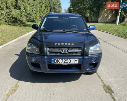 Синий Хендай Туксон, объемом двигателя 1.98 л и пробегом 152 тыс. км за 7450 $, фото 4 на Automoto.ua