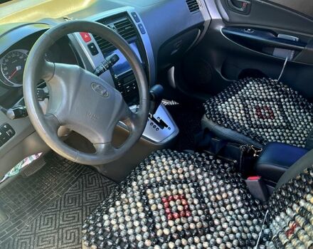 Синий Хендай Туксон, объемом двигателя 2 л и пробегом 280 тыс. км за 7500 $, фото 5 на Automoto.ua