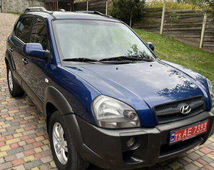 Синий Хендай Туксон, объемом двигателя 1.98 л и пробегом 230 тыс. км за 6555 $, фото 3 на Automoto.ua