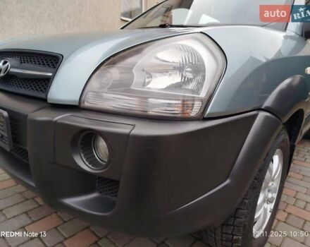 Синий Хендай Туксон, объемом двигателя 2 л и пробегом 213 тыс. км за 8900 $, фото 18 на Automoto.ua