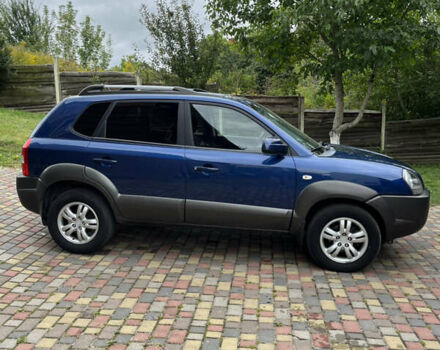 Синий Хендай Туксон, объемом двигателя 1.98 л и пробегом 230 тыс. км за 6555 $, фото 4 на Automoto.ua