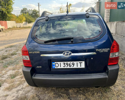 Синий Хендай Туксон, объемом двигателя 1.98 л и пробегом 210 тыс. км за 4500 $, фото 5 на Automoto.ua