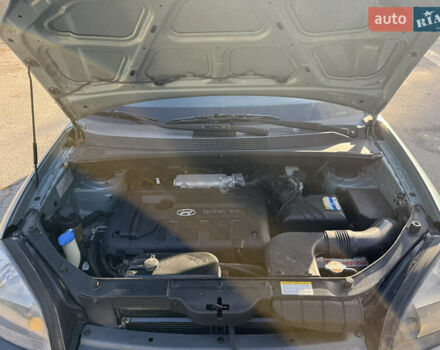 Синий Хендай Туксон, объемом двигателя 2 л и пробегом 205 тыс. км за 7500 $, фото 24 на Automoto.ua