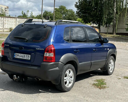 Синий Хендай Туксон, объемом двигателя 1.98 л и пробегом 220 тыс. км за 8000 $, фото 4 на Automoto.ua