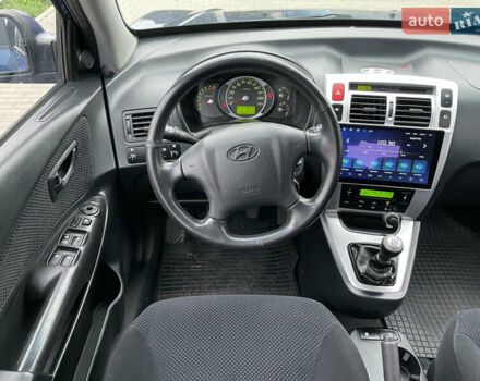 Синий Хендай Туксон, объемом двигателя 1.98 л и пробегом 163 тыс. км за 8000 $, фото 21 на Automoto.ua