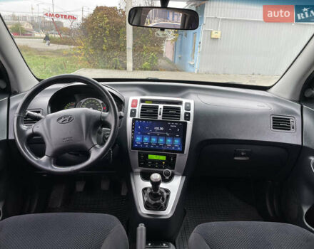 Синий Хендай Туксон, объемом двигателя 1.98 л и пробегом 163 тыс. км за 8000 $, фото 20 на Automoto.ua